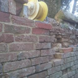 The external side of the wall was faced with a single skin of handmade bricks that had decayed and had to be repaired using matching handmade bricks.