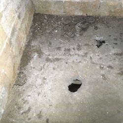 Due to a period in the buildings history when the building was roofless rain had eroded areas of the second floor lime mortar flooring. The areas adjacent to the voids maybe weakened. To minimise loss of the original floor the areas were repaired from beneath