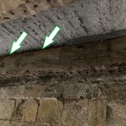 In some areas the laths that had supported the floor originally had rotted and were missing. The arrows points to the gap left by the laths. This gap between the timber and the floor was not supported and left the floor hanging and was liable to further cracking and long term failure.
